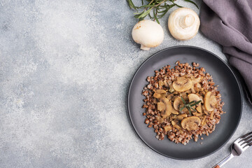 Boiled buckwheat with stewed mushrooms. Russian traditional food. Healthy diet food. copy space, top view.