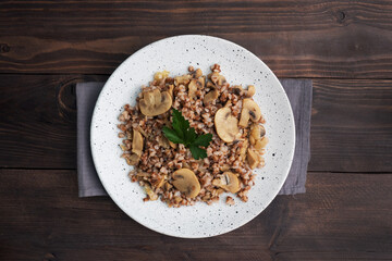 Boiled buckwheat with stewed mushrooms. Russian traditional food. Healthy diet food. copy space, top view.