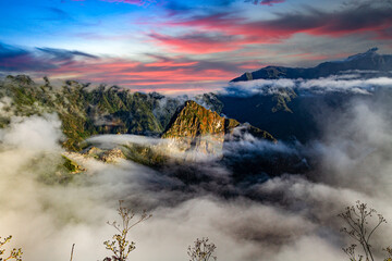 Machu Picchu,Inca Trail, Cusco,Peru: Overview of the lost inca city Machu Picchu, agriculture terraces and Wayna Picchu, peak in the background,Sunrise	