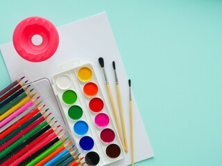 Children's set for the development of creativity. Watercolors, paper, colored pencils. Place for...