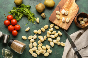 Composition with raw gnocchi on color background