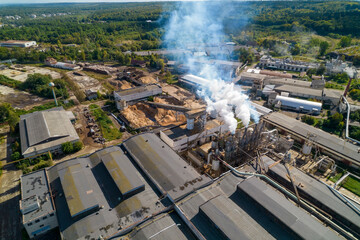 Industrial zone with large pipes thick white smoke is poured from the factory pipes. Pollution of the environment: a pipe with smoke. Aerial view