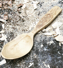 self made spoon from wood with carvings