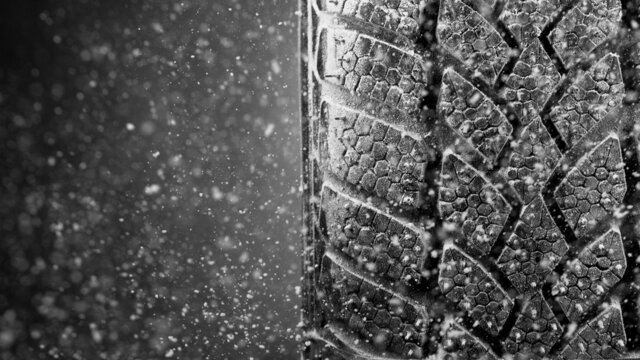 Winter Car tire with snow in detail