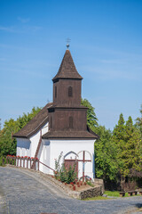 Old church of St. Martin on the street in ethnic village Holloko, Hungary
