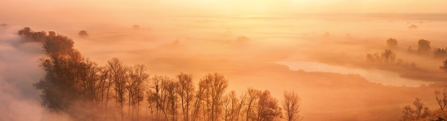 Naklejka na ściany i meble Autumn landscape, background - the morning fog over the river valley, horizontal panorama, banner