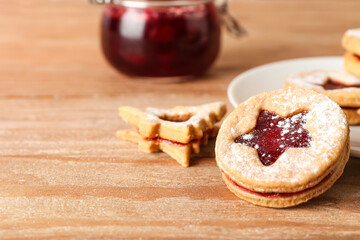 Tasty Linzer cookies on wooden table