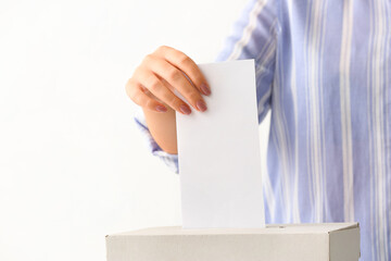 Voting woman near ballot box on white background