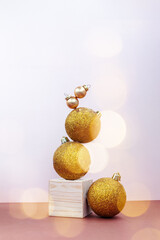Golden Christmas decorations balancing still life, greeting card template