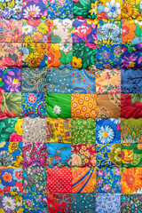 Creative traditional handmade patchwork blanket with bright colorful traditional design and flower patterns as vintage artwork - obrazy, fototapety, plakaty