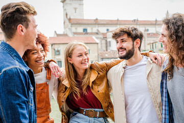 Friends laughing together - Multiracial guys having fun on the city street - Portrait of five students from different culture celebrating outside - Friendship, community, youth, university concept