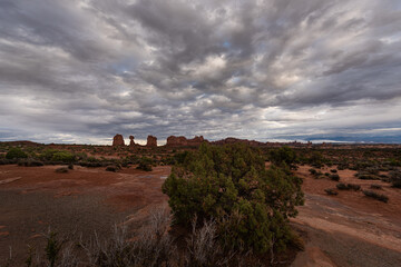 Fototapeta na wymiar Dramatic clouds over desert landscape of Arches National Park, Utah