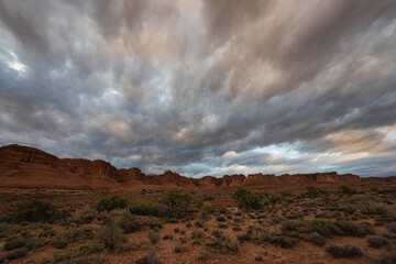 Fototapeta na wymiar Dramatic stormy sunset sky over desert landscape, Moab Utah