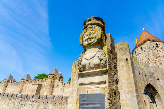 The bust of the famous Dame Carcass at the entrance of the drawbridge to the medieval fortress of Carcassonne.