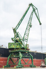Fototapeta na wymiar Mobile Harbor Green Crane for Bulk Handling