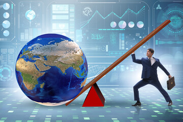 Businessman lifting the earth in challenge concept