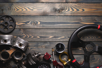 Car tuning accessories on the flat lay workbench background with copy space.
