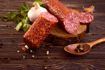 sausage salami, spices on деревянном background