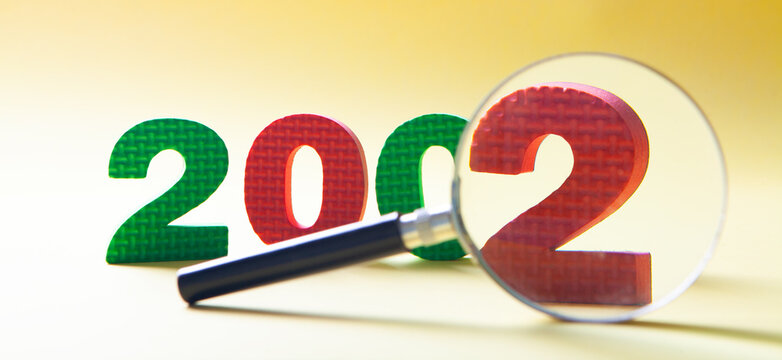 2002 inscription and magnifying glass