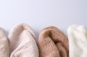 Terry cotton towels close-up on a light background