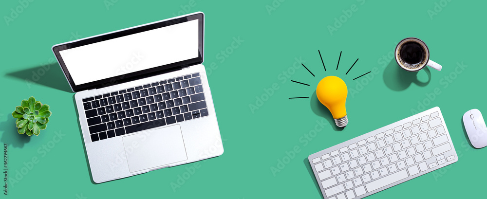 Poster computers with a light bulb from above