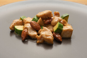 Almond chicken with zucchini, shallow depth of field