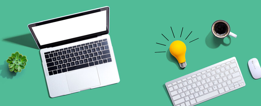 Computers with a light bulb from above