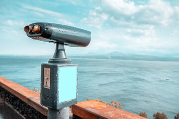 Coin-operated tourist telescope at the viewpoing on a shore of Lake Sevan in Armenia