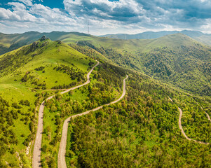 Aerial drone point of view over the serpentine mountain road near the Pushkin Pass in Armenia....