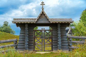 Wooden gate, entrance to the territory of the village church