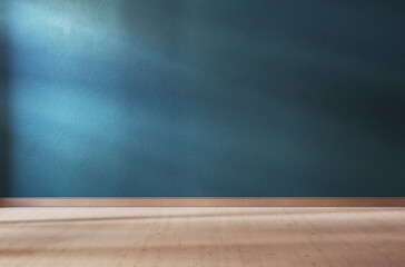 Teal textured wall and wooden floor in empty room for displaying your product, light coming through window.