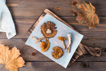 Dried fly agarics on parchment on a wooden table. Microdosing and Alternative Medicine. Top  view