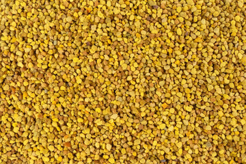 Bee pollen background. Natural herbal medicine to relieve inflammation, influenza, boosts liver health, strengthens immune system, reduces stress and used as a dietary supplement.