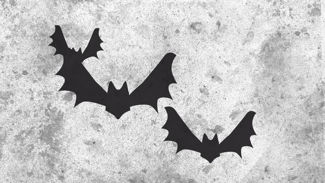 Animation of halloween spooky bats flying over white and grey moving background