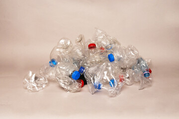 Gray background . Environmental concept. Large pile of used plastic btstok.Concept for the intelligent eco-friendly use of plastic
