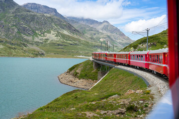 red train of bernina towards saint moritz