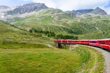Naklejka premium red train of bernina in switzerland