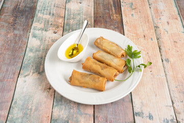 crispy Vietnamese rolls stuffed with pork stew with lemon-parsley sauce