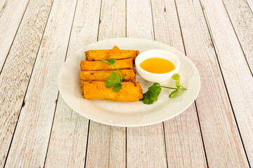 Vietnamese spring rolls fried in oil with crunchy texture and curry sauce