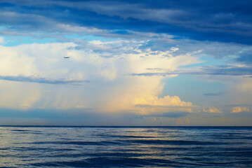 Plane, sea, thunderstorm