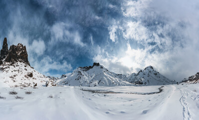 Beautiful panoramawinter scenery in the icelandic highlands with snow covered mountains and blue sky. Iceland, Highlands, expedition.