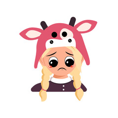 Girl with blonde hair and sad emotions, depressed face, down eyes in cow hat. Head of cute child with melancholy expression in carnival costume for the holiday, Christmas or New year
