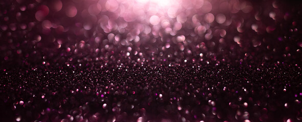 Abstract background of pink  glitter lights. De-focused background.