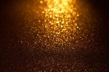 Background of gold and black glitter lights. De-focused abstract background.	
