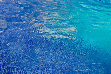 Bright neon water with backlight. Blue wave texture