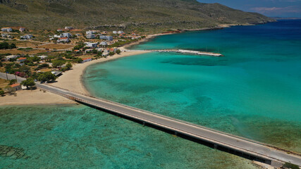 Aerial drone photo of main port of Kythera island and turquoise exotic beach of Diakofti, Ionian, Greece