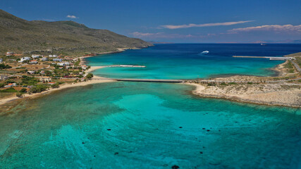 Aerial drone photo of main port of Kythera island and turquoise exotic beach of Diakofti, Ionian, Greece