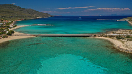 Aerial drone photo of tropical exotic paradise bay with deep turquoise sea and caves forming a blue lagoon visited by luxury yachts and sail boats