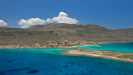 Aerial drone photo of main port of Kythera island and turquoise exotic beach of Diakofti, Ionian, Greece
