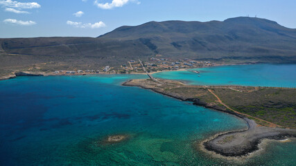 Aerial drone photo of main port of Kythera island and turquoise exotic beach of Diakofti, Ionian, Greece